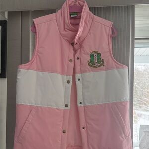 Alpha Kappa Alpha White Puffer Vest
Buy this- pink and green hair ties for free